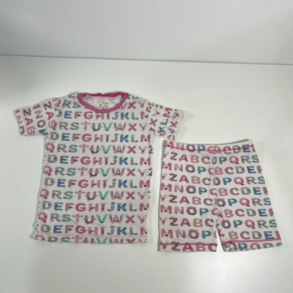 KicKee Graphic Short Sleeve Pajama Set, Ultra Soft and Snug Natural ABC Monsters